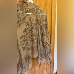 Cute kimono! Got it from a yoga festival event. Good quality material.